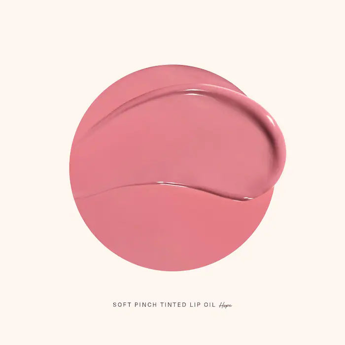 image showing swatch of 100% original Rare Beauty Soft Pinch Tinted Lip Oil in Hope shade available at Heygirl.pk for delivery in Pakistan.