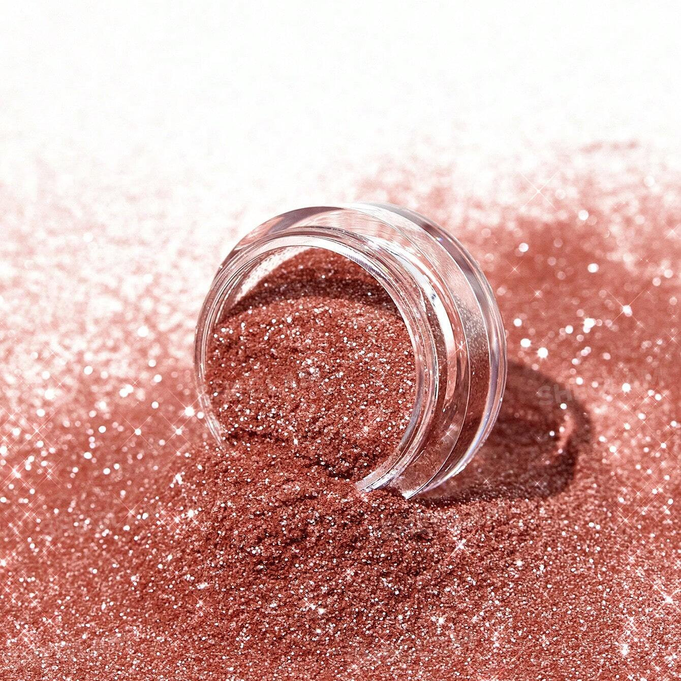 Rose gold glitter with a clear jar on a white background