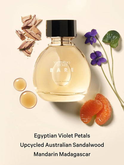 Victoria's Secret Bare perfume bottle with Egyptian Violet Petals, Upcycled Australian Sandalwood, and Mandarin Madagascar text on a beige background.