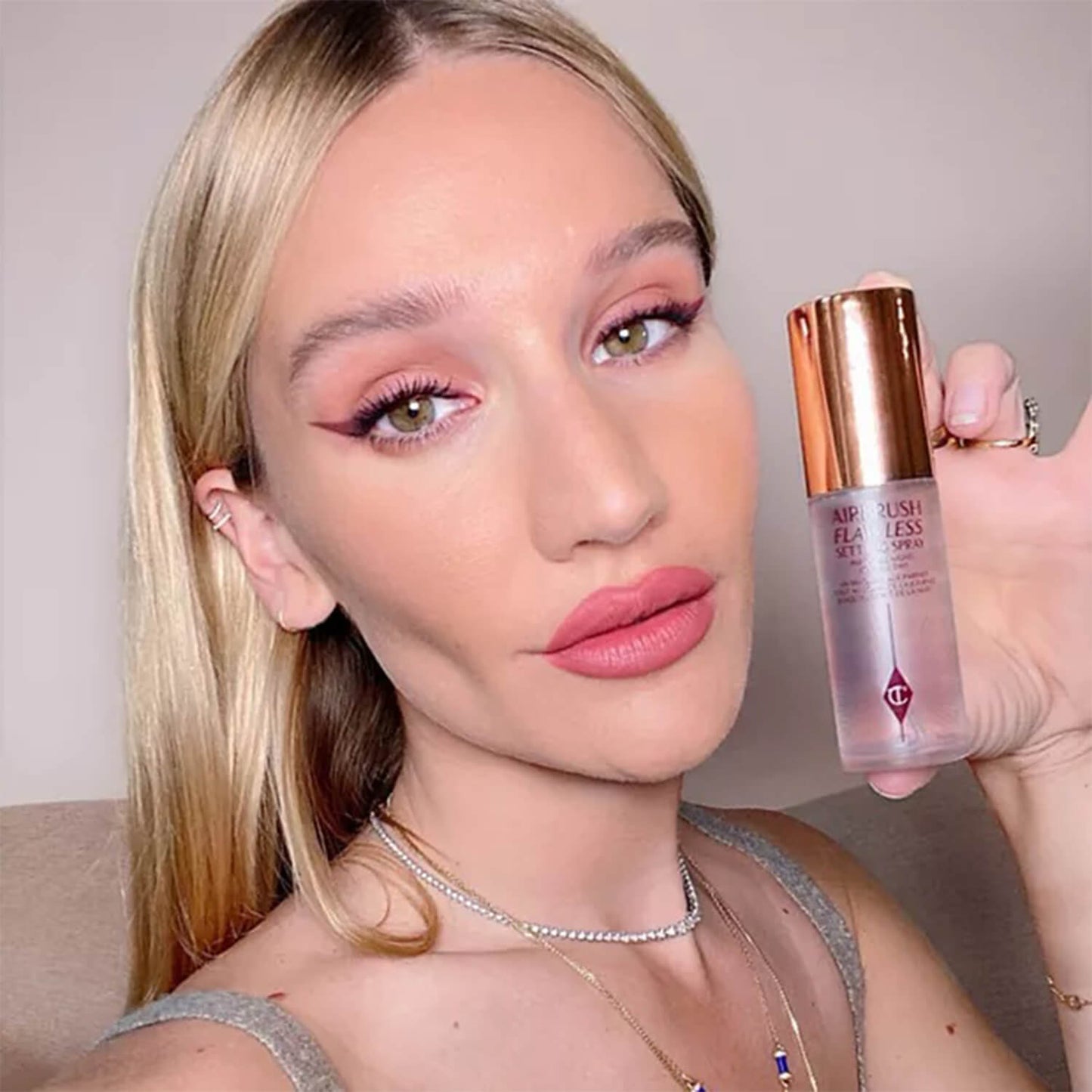 image showing beautiful girl with Charlotte Tilbury Airbrush Flawless Setting Spray duo available at Heygirl.pk for delivery in Pakistan. 