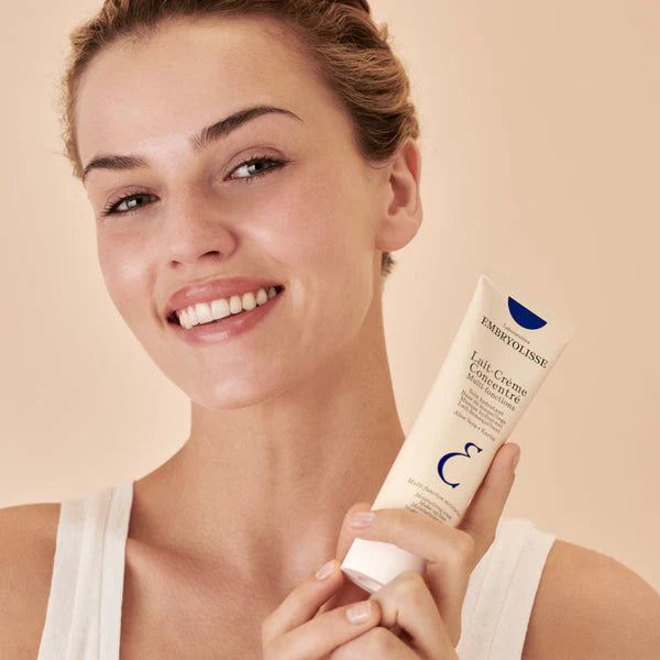 image showing happy girl with Embryolisse Lait-Crème Concentré Face & Body Cream available at Heygirl.pk for delivery in Pakistan.