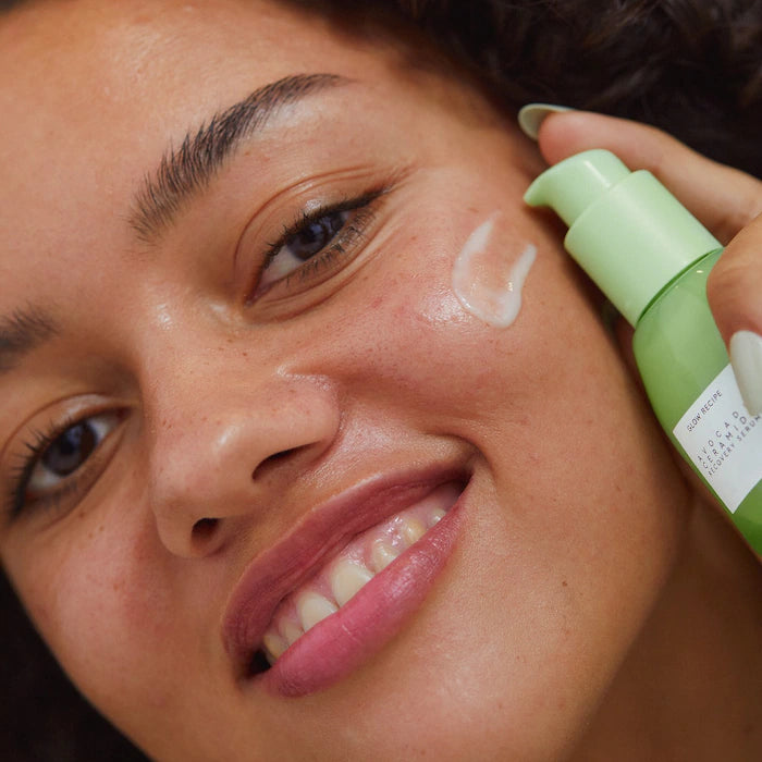 image showing beautiful happy girl applying glow recipe avocado recovery serum available at Heygirl.pk for delivery in Pakistan