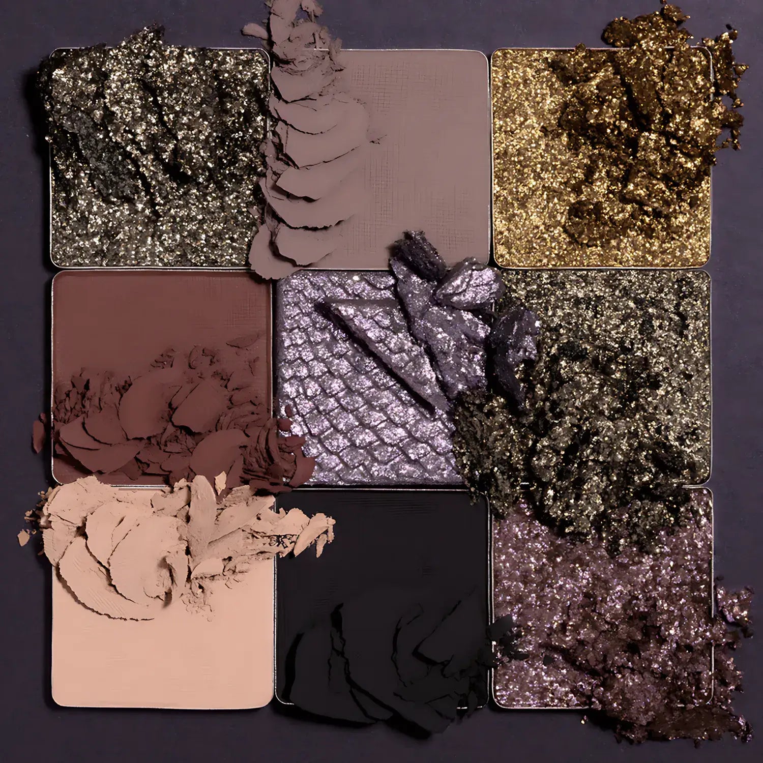 Makeup palette with various shades of eyeshadow on a dark background