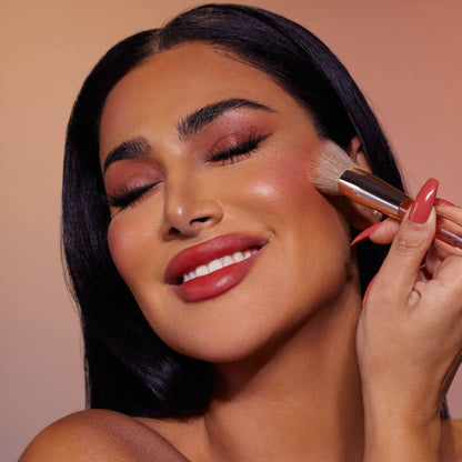 image showing Huda using Tint Blush Face Makeup Brush available at Heygirl.pk for cash on delivery in Pakistan. 
