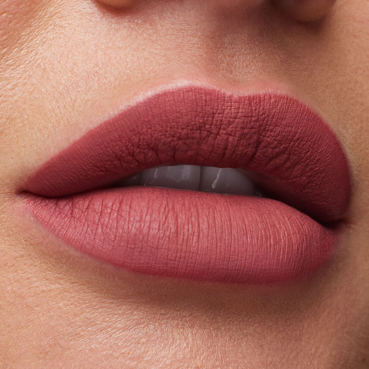 swatch image of Huda Beauty liquid lipstick in bombshell shade available at Heygirl.pk for delivery in Pakistan