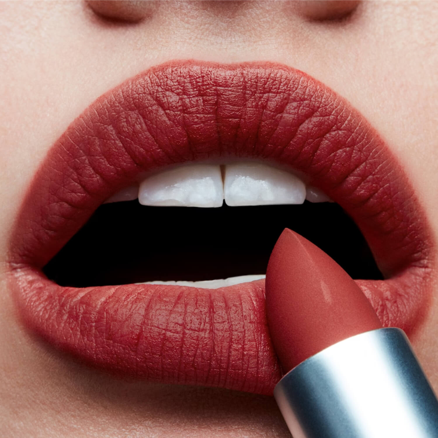 swatch of MAC Powder Kiss Lipstick - Devoted to Chilli available at Heygirl.pk for delivery in Karachi, Lahore, Islamabad across Pakistan.