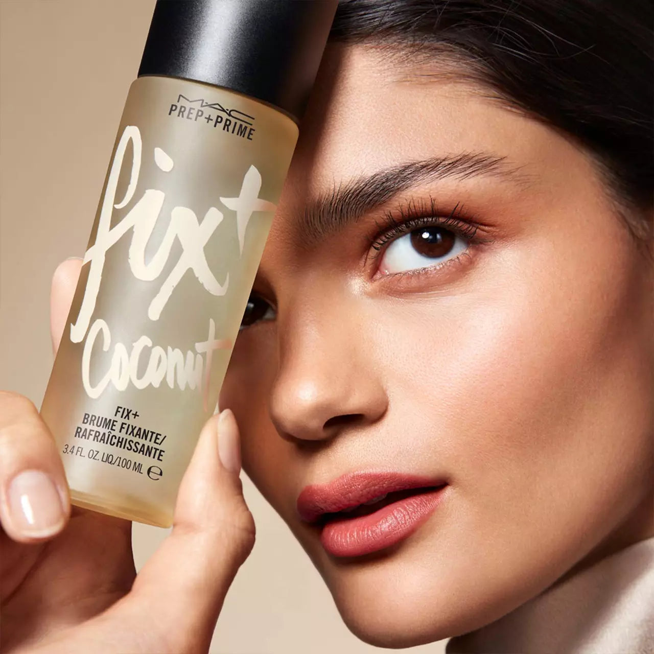 image showing Pakistani girl with Mac setting spray in coconut available at Heygirl.pk for delivery in Karachi lahore islamabad pakistan