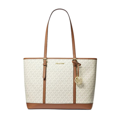 100% original Michael Kors tote bag in cream monogram canvas with brown leather trim, double shoulder straps, and a hanging gold-tone MK charm available at Heygirl.pk in Pakistan