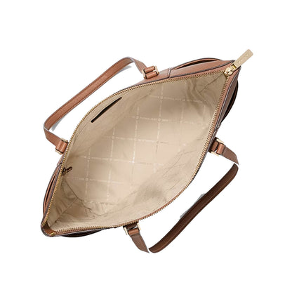An open brown leather handbag shown from above, revealing a beige quilted interior lining and a matching brown shoulder strap on a plain white background.