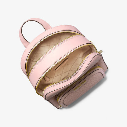 Pink backpack with gold zipper on a white background