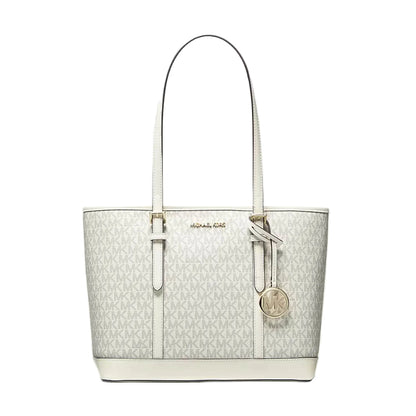 100% original Michael Kors tote bag in off-white monogram canvas with cream leather trim, dual top handles, gold-tone hardware, and a hanging MK charm available at Heygirl.pk in Pakistan