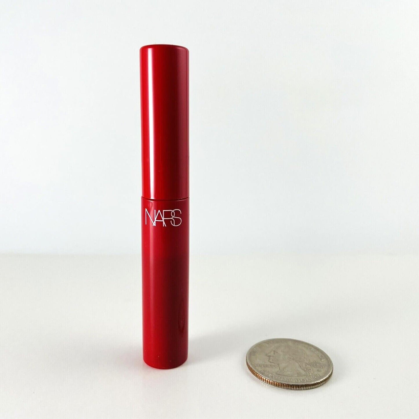 image showing NARS Climax Mascara with a coin available at Heygirl.pk for delivery in Pakistan. 