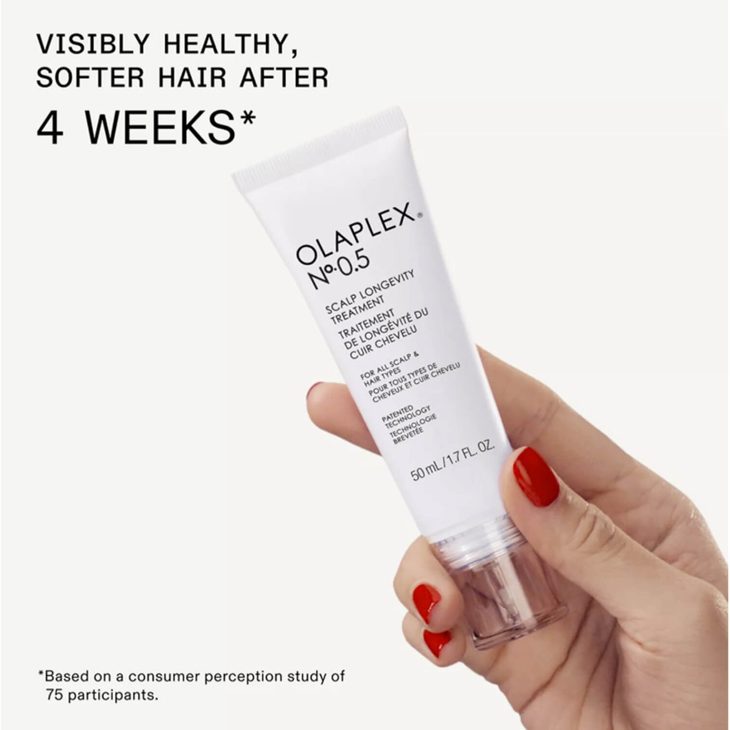Olaplex No. 05 hair treatment tube held by a hand available at Heygirl.pk for delivery in Pakistan