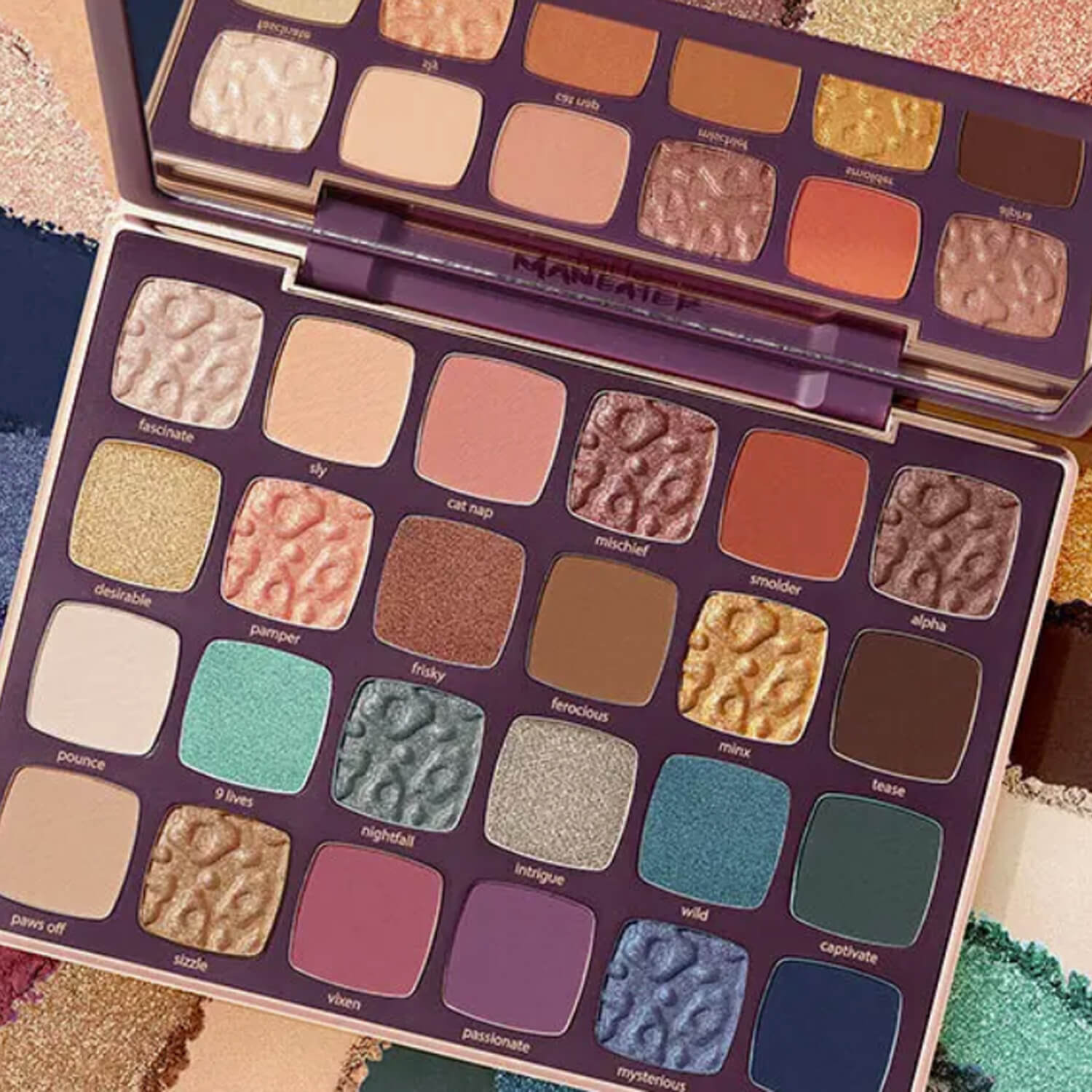 Makeup palette with various colors on a textured surface