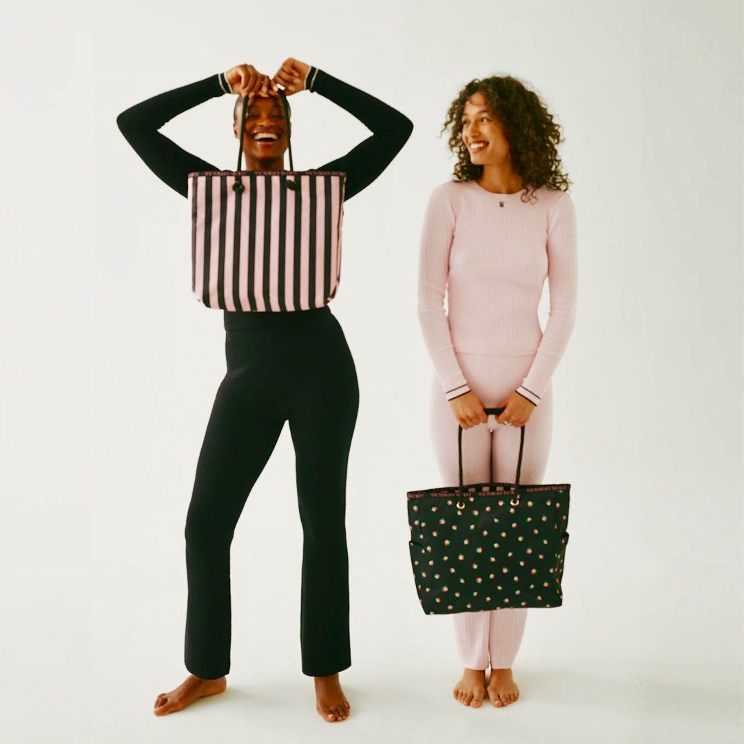 two models holding victoria's secret gym tote bag